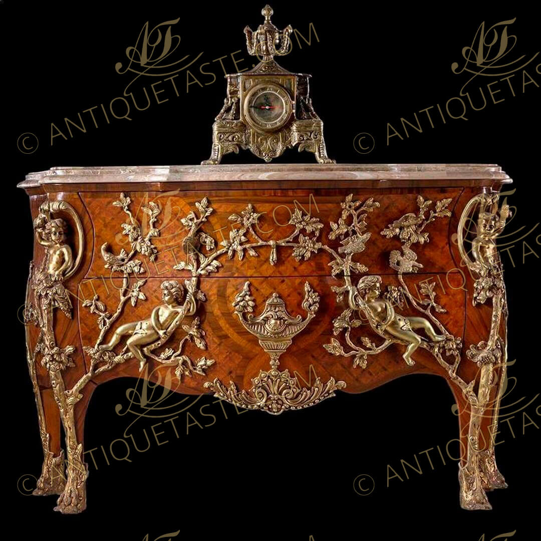 An extraordinary French Louis XV Régence style gilt-ormolu-mounted parquetry commode à pipée des oiseaux after the celebrated model by Charles Cressent by Maison Millet circa 1720, Paris, with serpentine marble top above a pair of drawers inlaid with trellis parquetry, centered by ormolu urn flanked by reclining putti and courting doves on oak branches and foliate ormolu works above a serpentine scalloped  apron centered by a fine burnished leafy shell cartouche, the angles with crossed oak trunks with a putto to each angle holding a bird, raised on four cabriole tapering legs with leafy ormolu oak-trunk front cast sabots